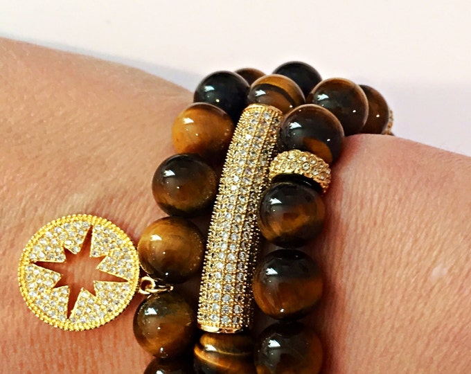 Tigers eye beaded stretch bracelet. 10mm beads with yellow gold crystal bar tube. Handmade with semi-precious beads.