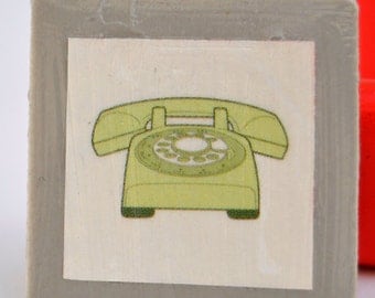 Tile magnet with green retro rotary telephone vintage on grey background