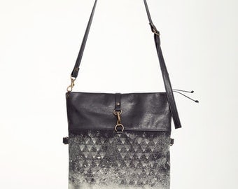 ÉTINCELLE - leather messenger bag, foldable - black with deconstructed silkscreen like edgy and grunge