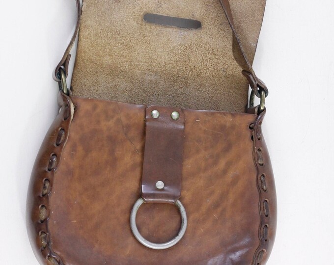 Vintage tooled leather handbag // saddle leather cartridge bag // boho hippie flower tooled shoulder bag