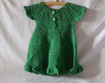 Crocheted baby dress in green