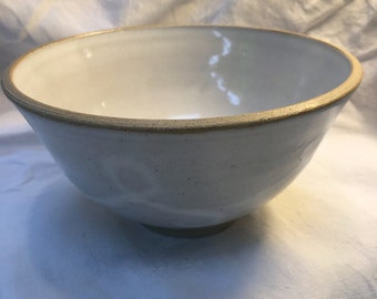 creamy white shiny bowl with trailing slip detail