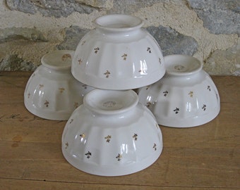 Set of white coffee bowls with gilded flowers, French cafe au lait bowls
