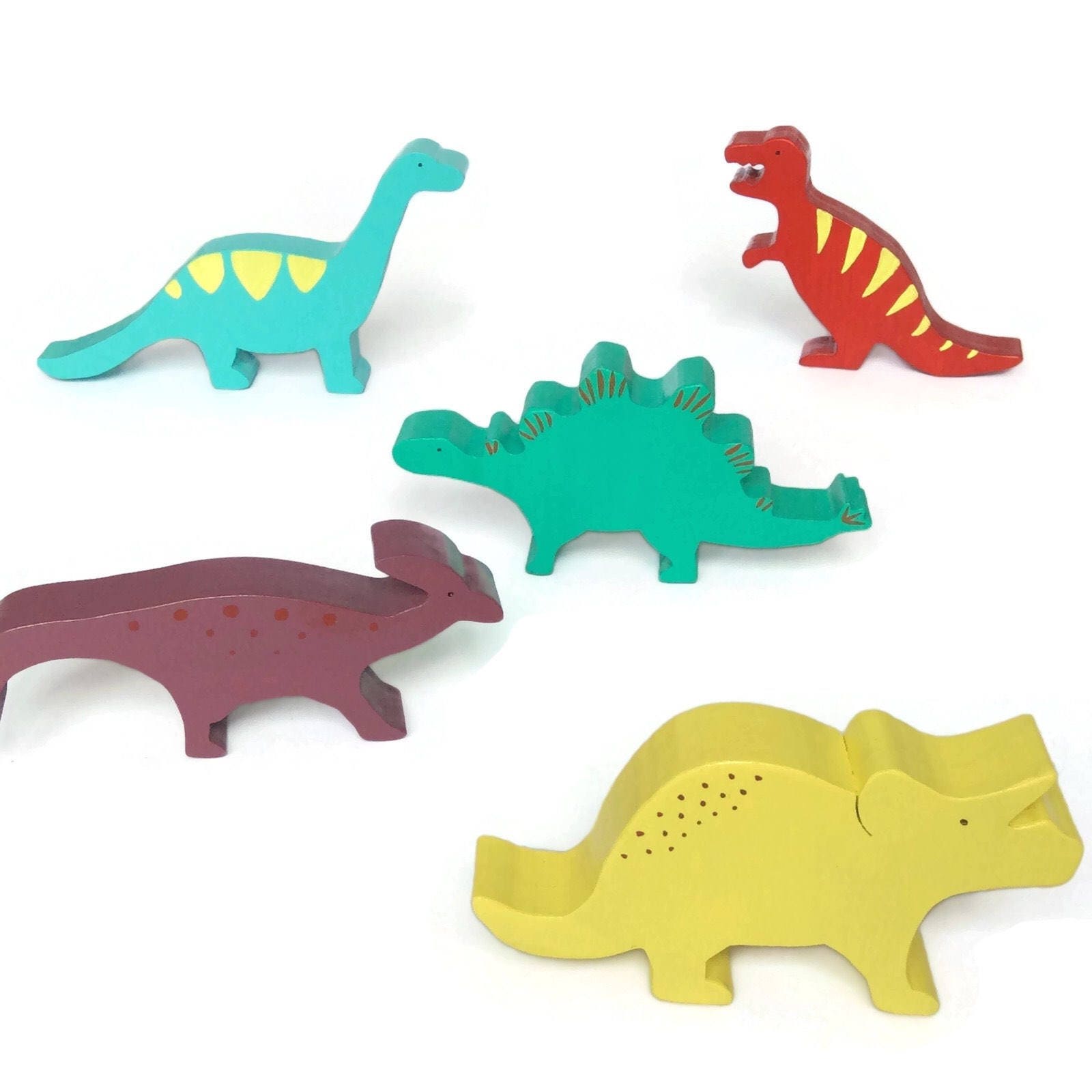 Set of wooden toy dinosaurs painted bright colours waldorf