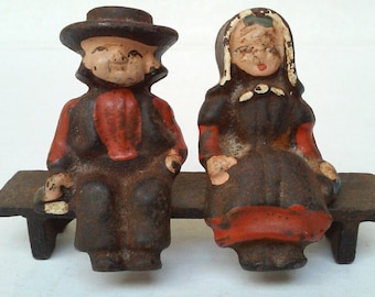 Vintage Amish Couple on Bench Cast Iron Figurines Man Woman Pennsylvania Dutch