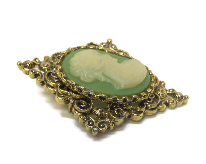 Gerry's cameo brooch, antiqued gold filigree diamond shape with oval cream lucite cameo on mint green field