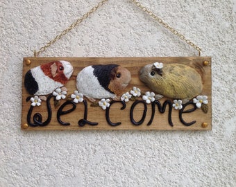 Guinea pigs welcome sign