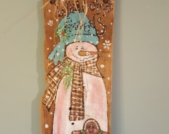 Hand painted snowman on very old barnwood