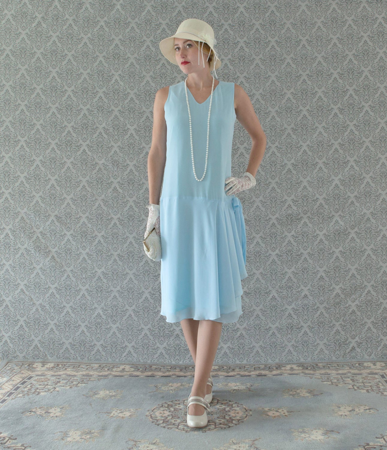 Light blue 1920s-inspired flapper dress with drape and bow