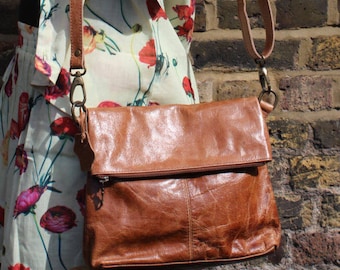 Amelie Tan Leather Foldover Messenger with Pockets front and back.