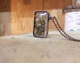 Rectangle captured brass leaves necklace