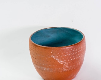 Chunky textured terracotta bowl with white tin wash and duck egg blue interior