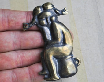 Vintage metal toilet door sign.