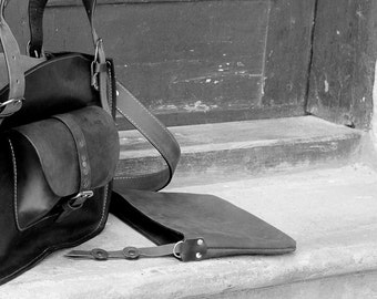A small clutch in the color of your bag