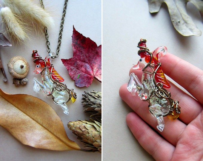 Magical necklace "Unicorn" with glowing in the dark wire wrapped glass pendant with flame color horn, mane & tail. Custom chain length.
