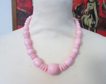 Vintage 1960s-style baby pink plastic graduated ball & donut bead collar necklace
