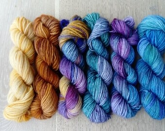 Lots of 6 mini skeins of wool catching ring