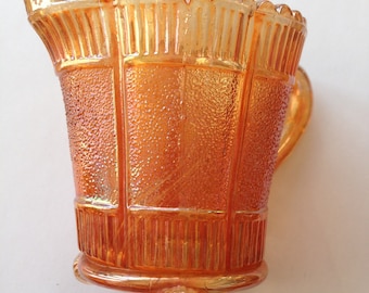 Gorgeous vintage peach iridescent lustre carnival glass creamer jug with three feet