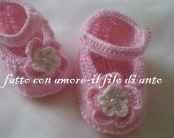 Pink ballerina type shoes with flower and bead