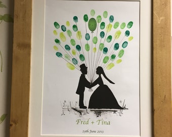 Happy couple fingerprint guestbooks, weddings