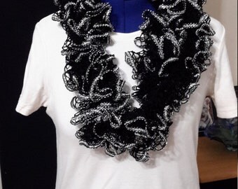 Black yarn with silver metallic yarn on the bottom
