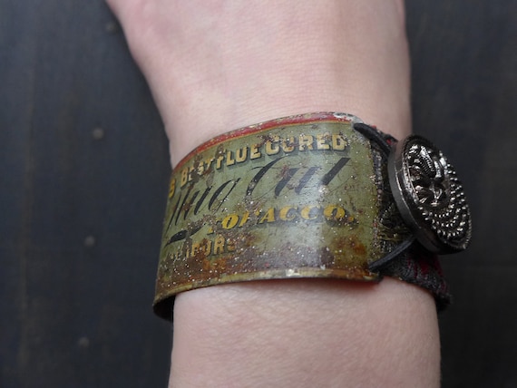 Rustic artisan bracelet with salvaged tin. Mixed media assemblage art- “Scribe of Fools” 