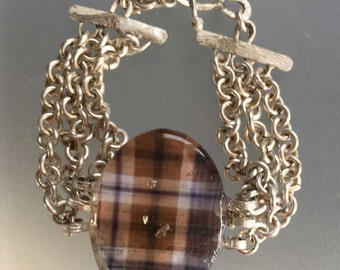 Sterling silver cuff/bracelet with a blue and brown plaid cabochon