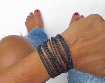 double wrap leather bracelet in your color choice with lobster clasp chain closure. bangle style boho jewelry.
