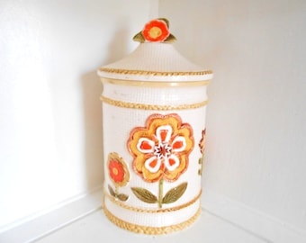 Ceramic Cookie Jar Canister Retro Vintage Mid Century Mod Flowers Orange Yellow Green Burlap background