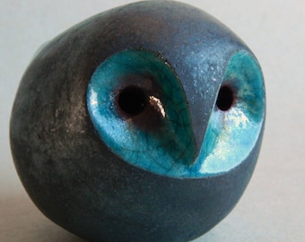 The owl is tin whistle, ceramic sculpture, Raku ceramic