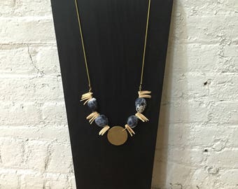 Shells, stones, and brass necklace