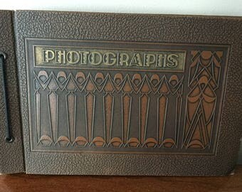1930 SCRAPBOOK. Amazing string tied album with photo corners. Beautiful Art Deco cover in great condition. Perfect for antique photos.