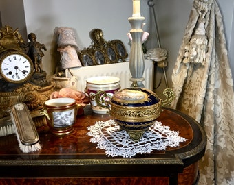 Bronze-gilded and porcelain cup