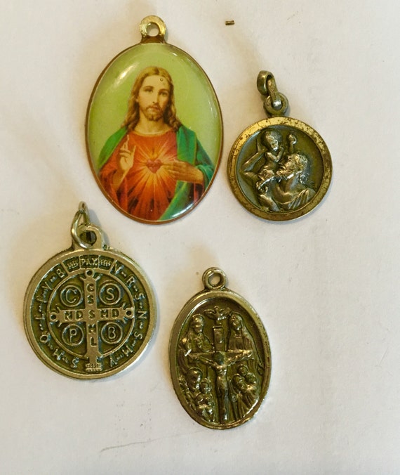 Small religious medallions by VintagesilverStudio on Etsy