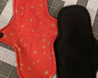 TWO cloth pads. Red with gold stars, cotton topped fleece backed mama cloth, RUMPs