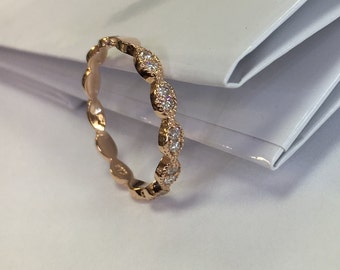 14k Rose gold band with white diamonds