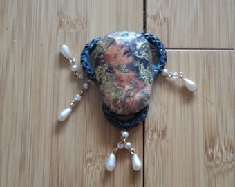 Brooch with woman's face