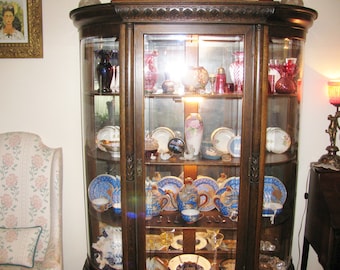 Victorian golden oak china cabinet refinished dark with tall clawfoot legs