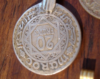 Tarnished Moroccan 20 franc coin with bail or loop