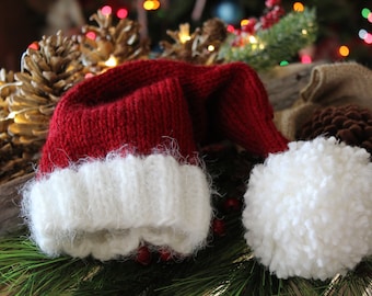 Hand Knitted Baby Santa Hat//0 to 6 months Santa Claus Hat//Baby Beanie//Cranberry Red Santa hat with fuzzy, frizzy brim//Christmas Baby hat