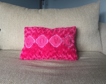 fuzzy light pink pillow