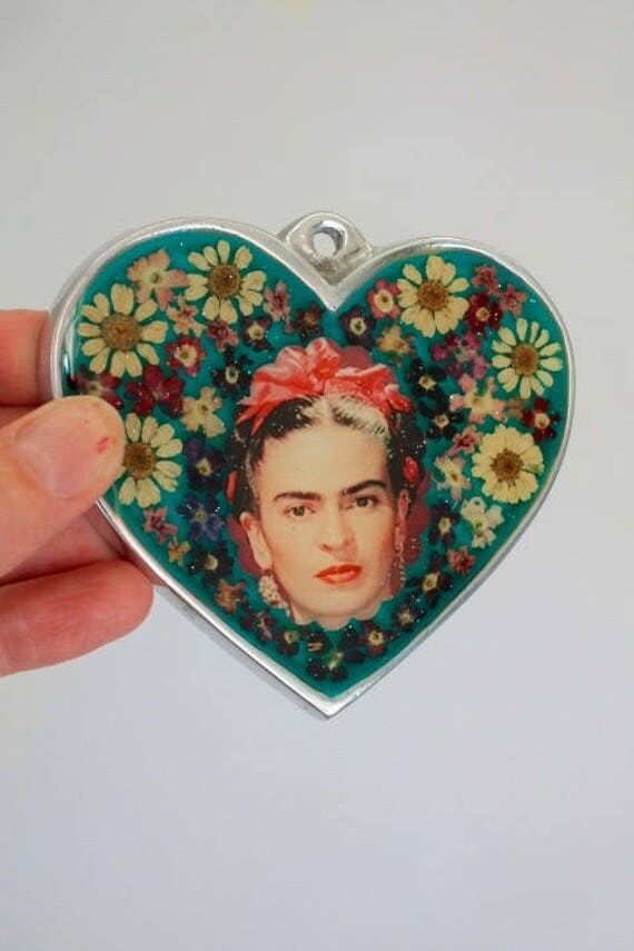 Mexican silver heart with image of Frida Kahlo under glass
