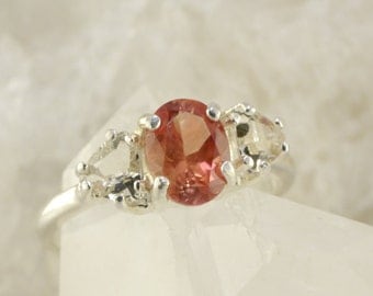 Red Oval Oregon Sunstone Ring with Clear Trillion Oregon Sunstone Accents in Sterling Silver