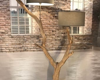Double floor lamp of old weathered oak branch.
