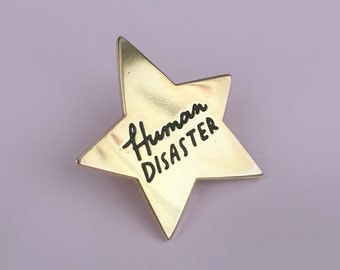 Human Disaster, gold star enamel pin