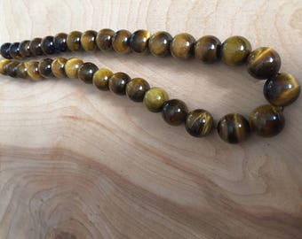 Strand of 12mm Tiger Eye Round Beads- 33 pcs.