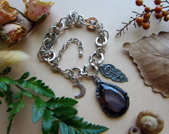 Adjustable size chunky bracelet with chocolate brown Druzy Agate, crescent moon charm, and rustic key charm. Total length 9.5".