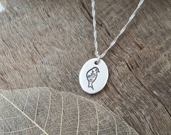 Fine silver pendant with bird detail
