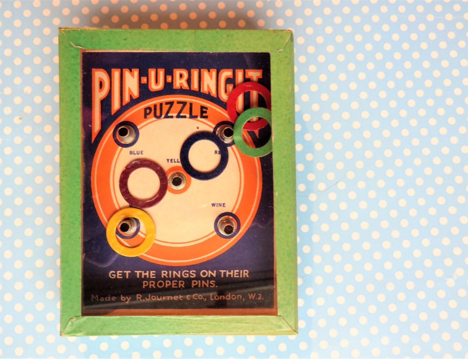 Vintage hand held puzzle game PinURingit by R and