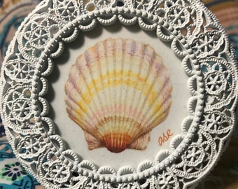 Seashell drawing in ornate white frame